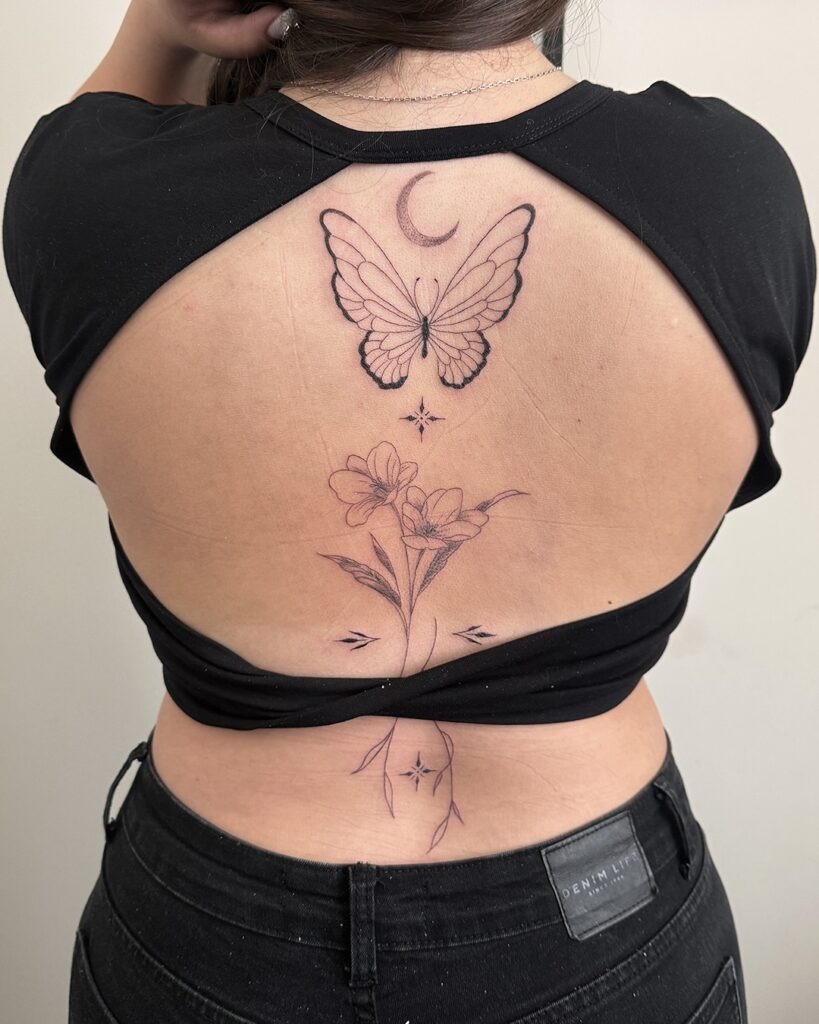 Butterfly and Moon Back Tattoo with Floral Accents Tattoo Design