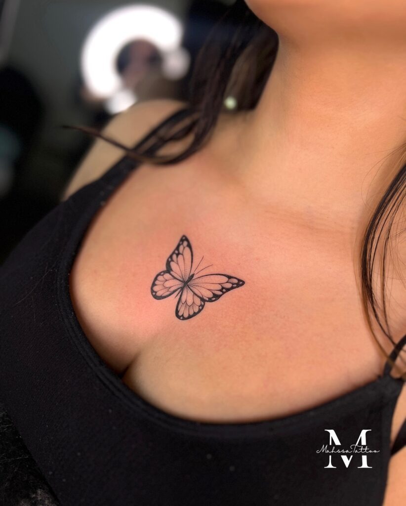 Butterfly Chest Tattoo with Bold Wing Tips Tattoo Design