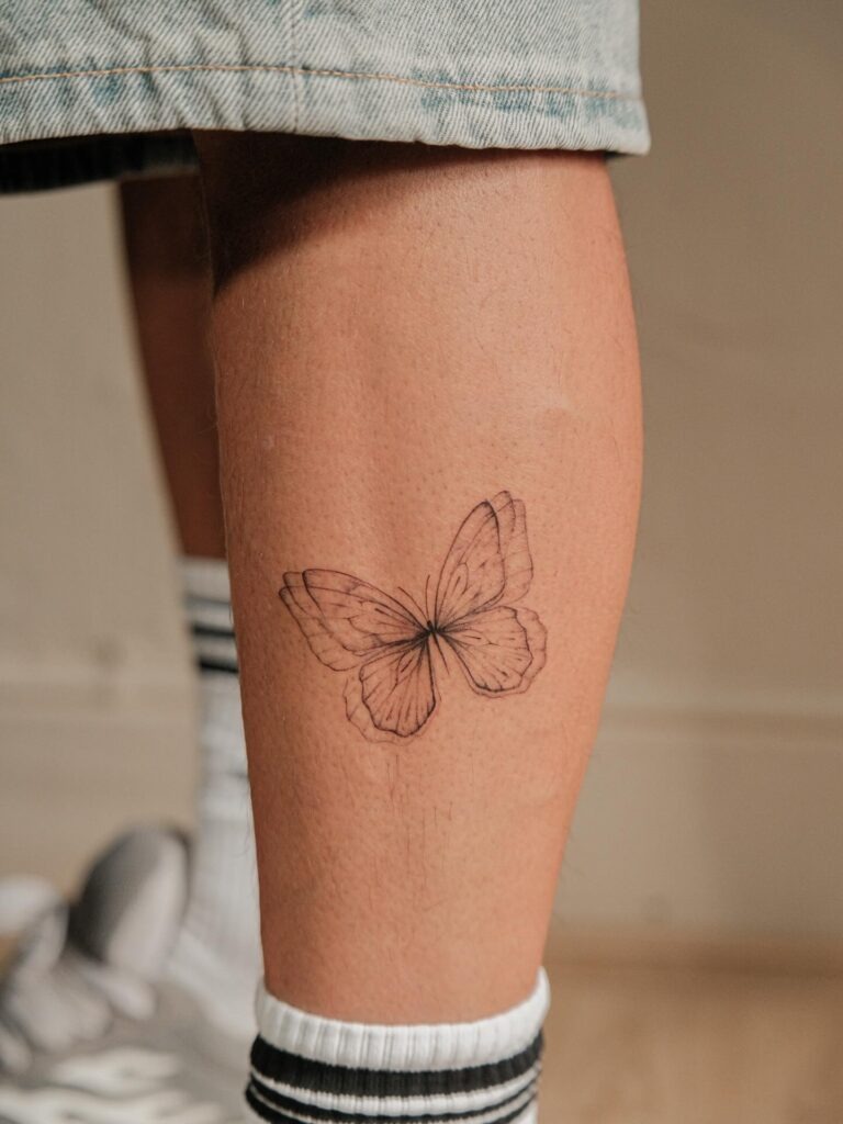 Butterfly in Flight on the Leg Tattoo Design