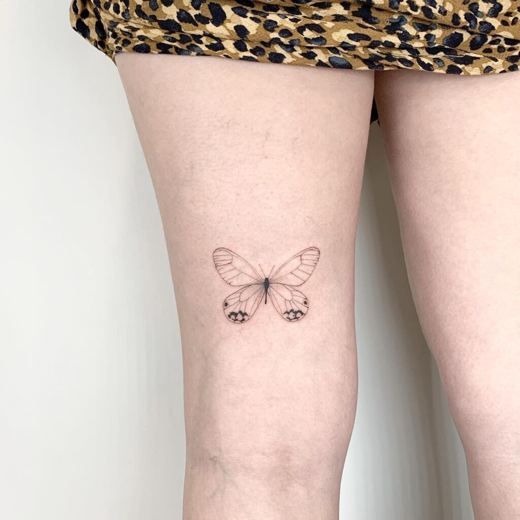 Fine Line Butterfly on the Thigh Tattoo Design
