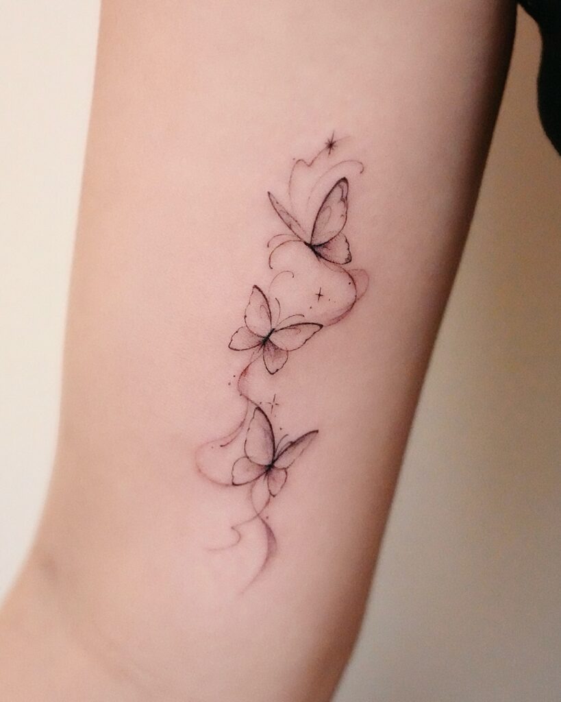Flow of Butterflies with Sparkling Accents Tattoo Design