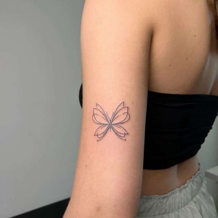 Minimalist Abstract Butterfly on the Arm Tattoo Design
