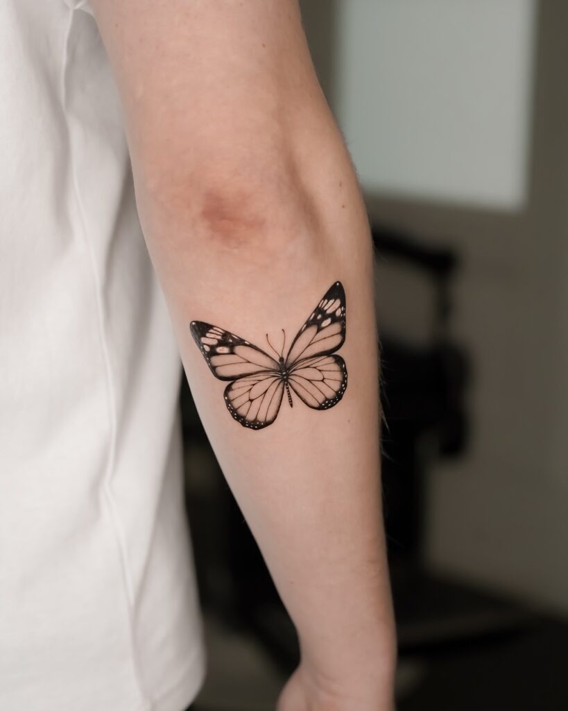 Realistic Butterfly on the Forearm Tattoo Design