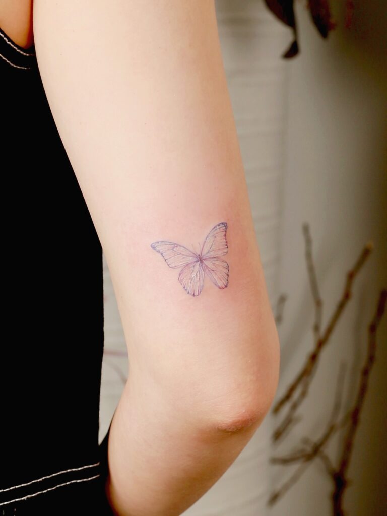 Simple Fine Line Butterfly on the Arm Tattoo Design