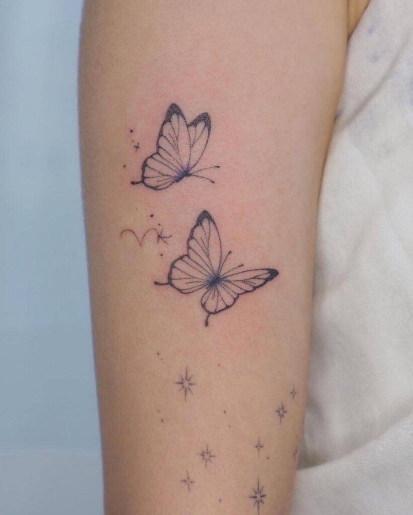 Starry Butterfly Duo on the Arm Tattoo Design
