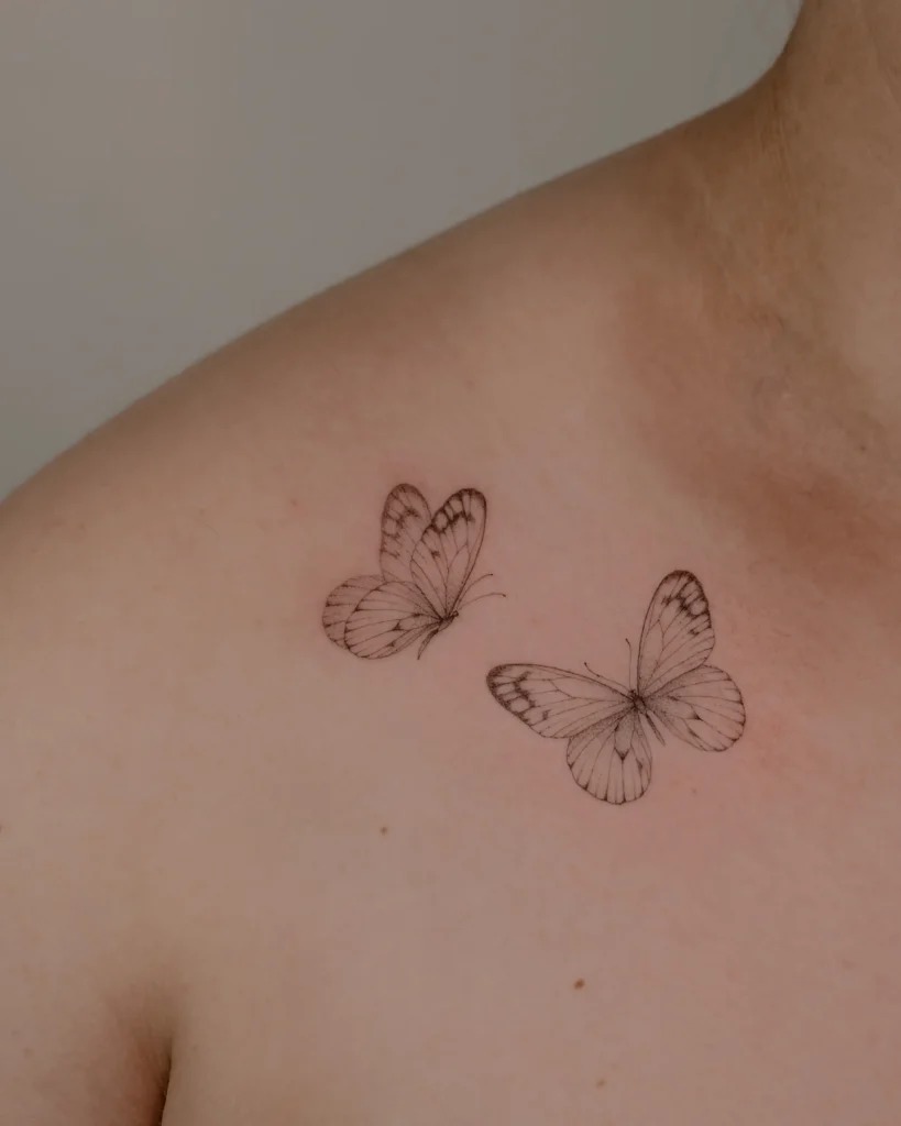 Two Fine Line Butterflies on the Collarbone Tattoo Design