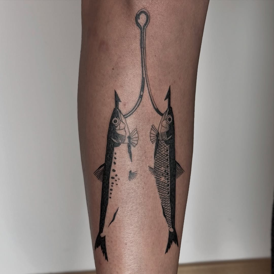 Intricate fish tattoo with fishing hook design Tattoo Design