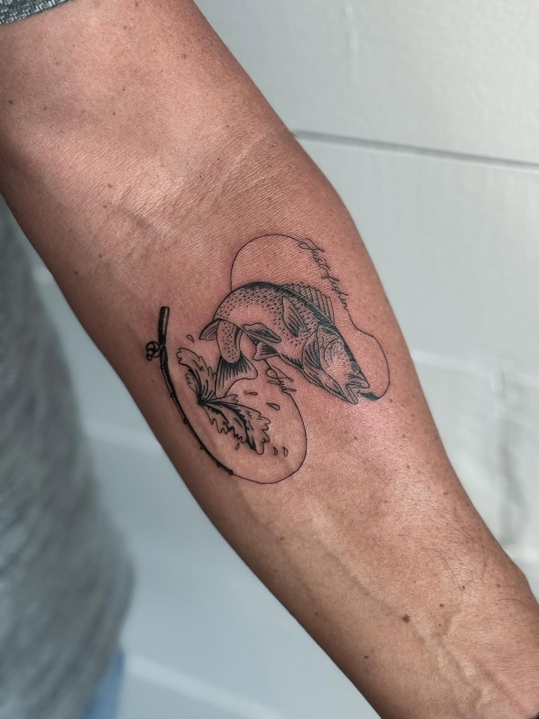 Stylish fish tattoo capturing the thrill of fishing Tattoo Design