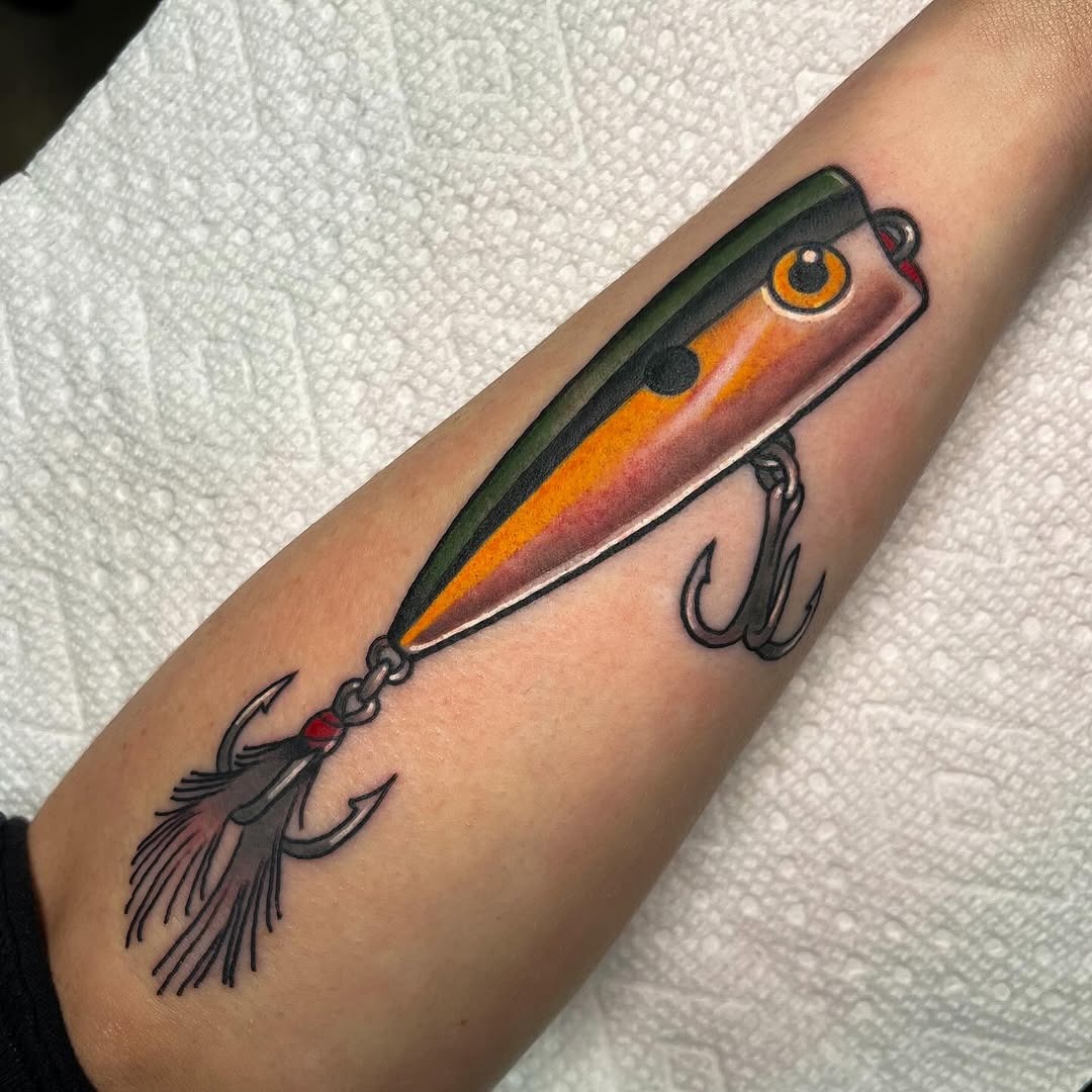Vibrant Fishing Lure Tattoo on Forearm Tattoo Design