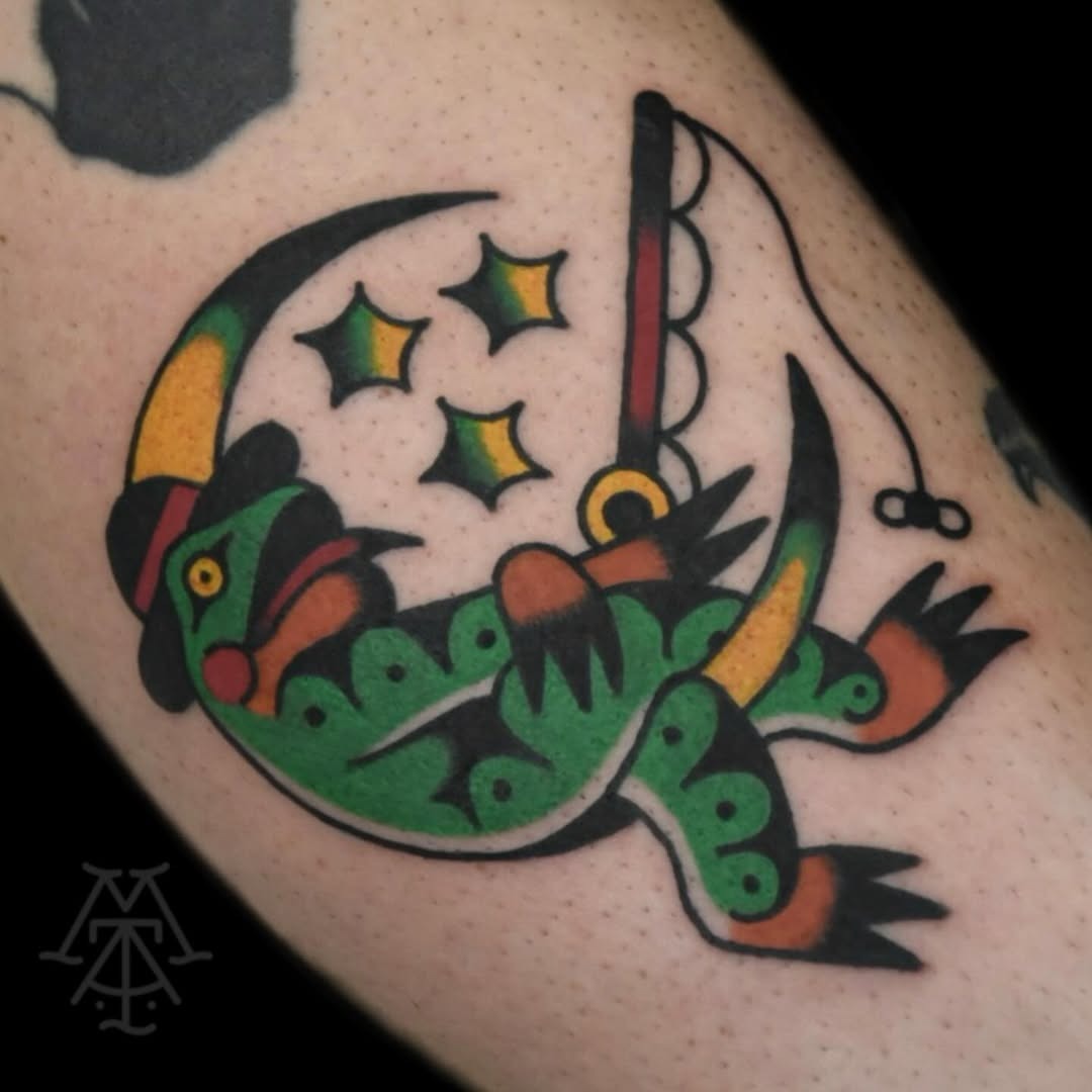 Whimsical frog fishing under the stars Tattoo Design
