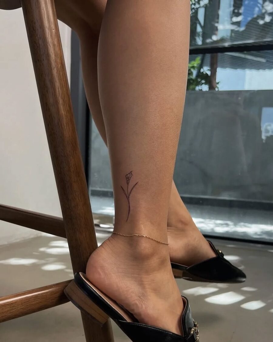 Chic minimalist flower ankle tattoo design Tattoo Design