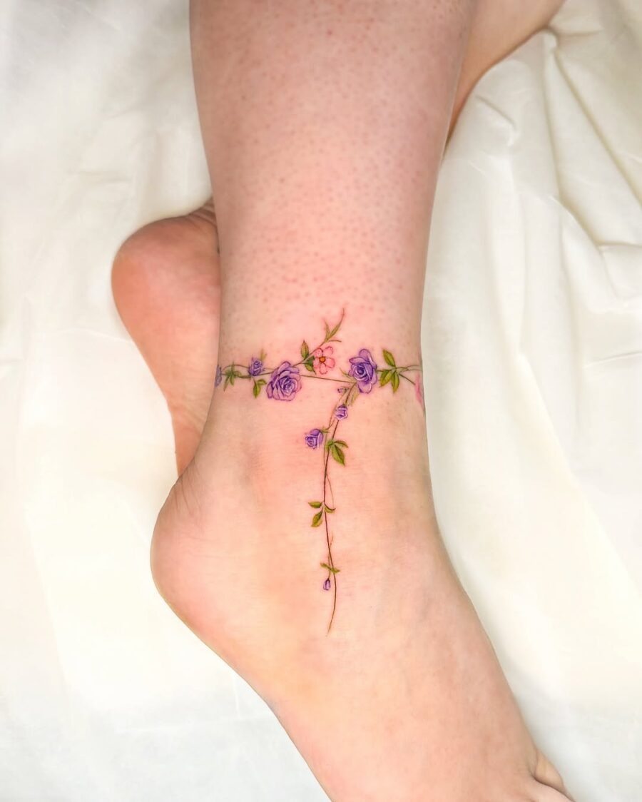 Dainty floral design wraps around the ankle Tattoo Design