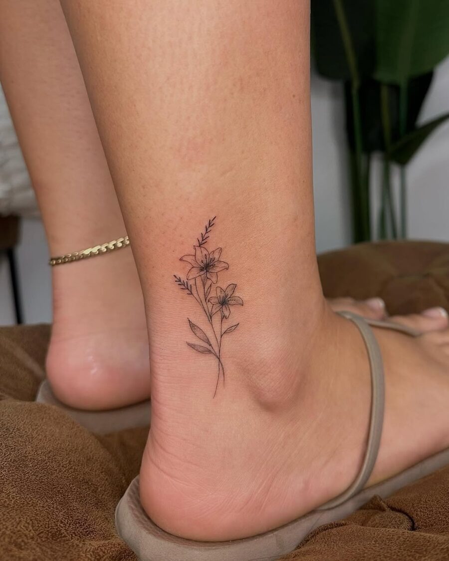 Delicate ankle tattoo with floral elements Tattoo Design