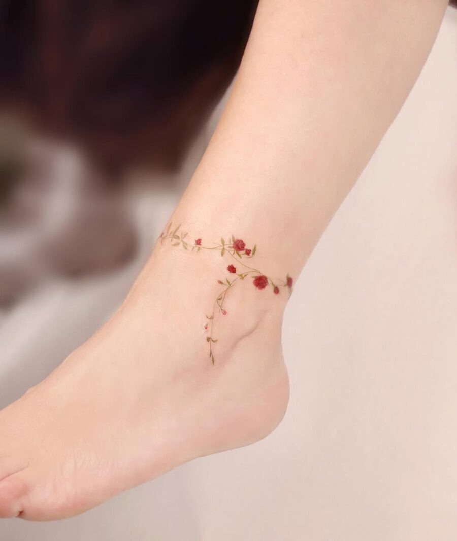 Delicate flower ankle tattoo with elegant roses Tattoo Design