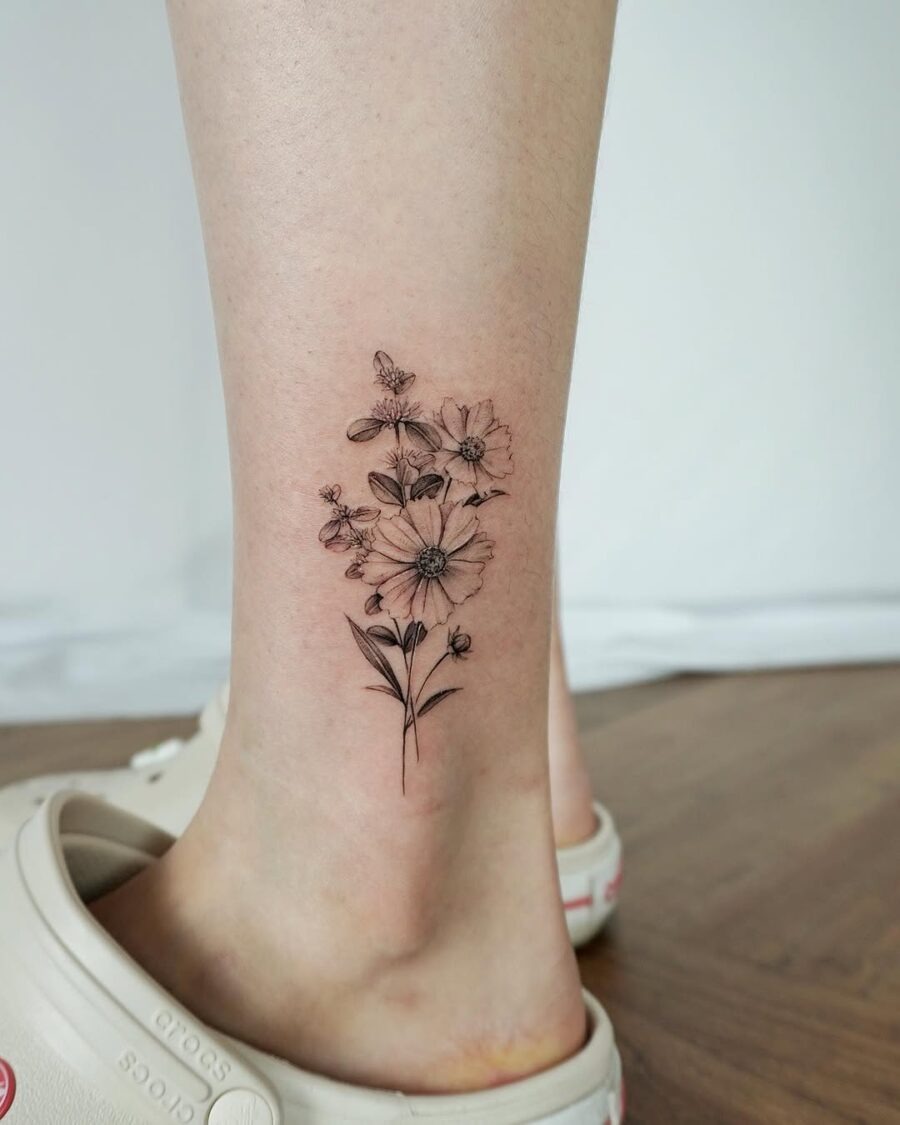 Delicate flowers surrounded by buzzing bees Tattoo Design