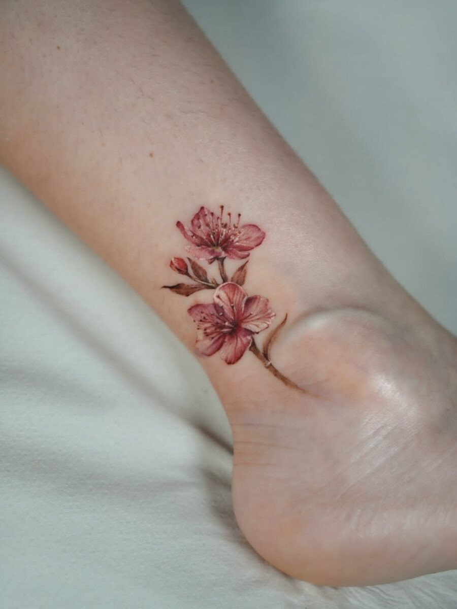 Delicate pink blooms for a graceful look Tattoo Design