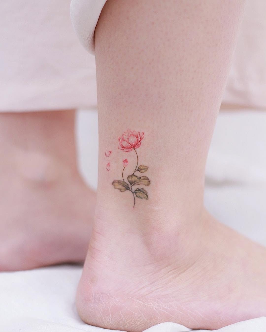 Delicate pink rose ankle tattoo design Tattoo Design