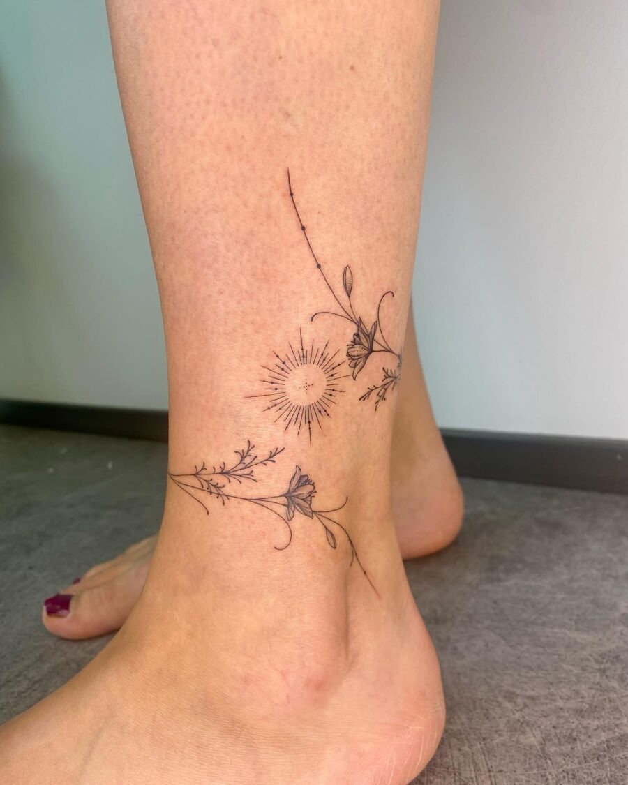 Elegant floral ankle tattoo featuring sun design Tattoo Design