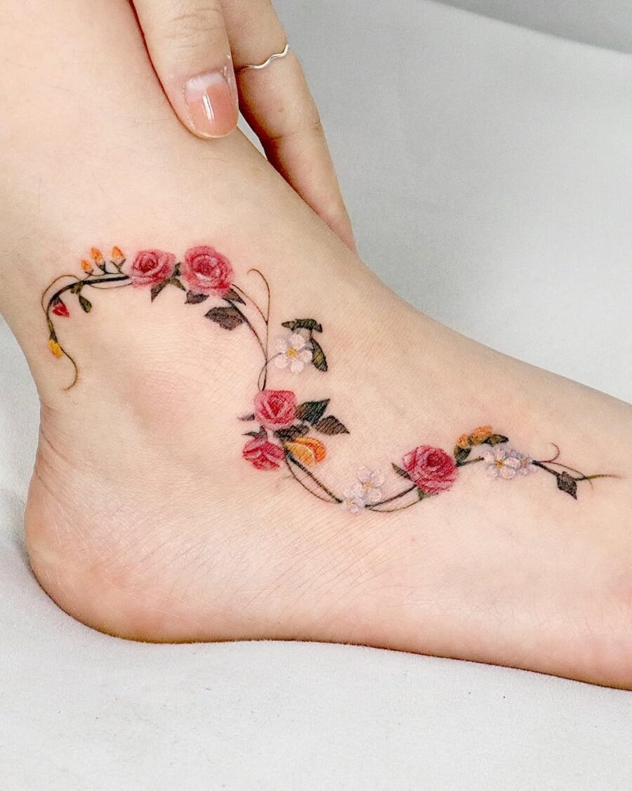 Elegant Floral Ankle Tattoo with Vibrant Roses Tattoo Design