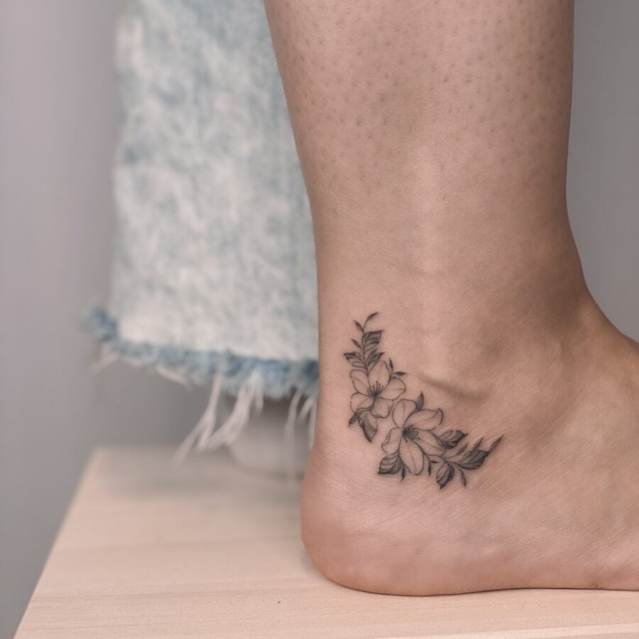 Elegant floral design enhancing ankle aesthetics Tattoo Design