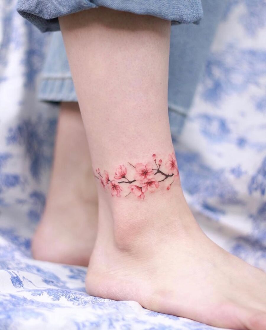 Elegant pink blossoms wrapping around the ankle Tattoo Design
