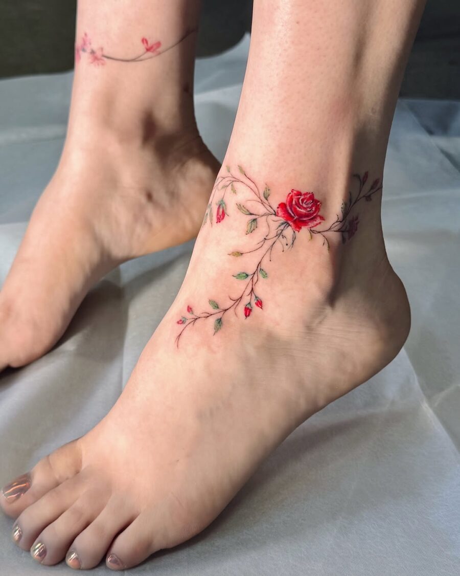 Elegant rose tattoo wraps around the ankle Tattoo Design