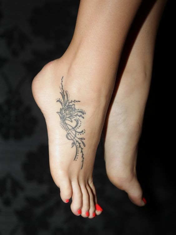 Beautiful Design on Woman’s Foot Tattoo Design