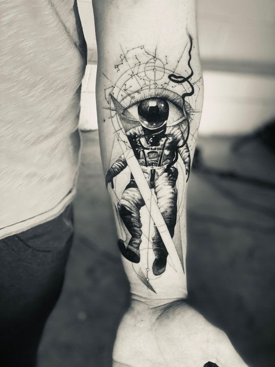 An Astronaut’s Helmet is Also an Eye forearm tattoo Tattoo Design