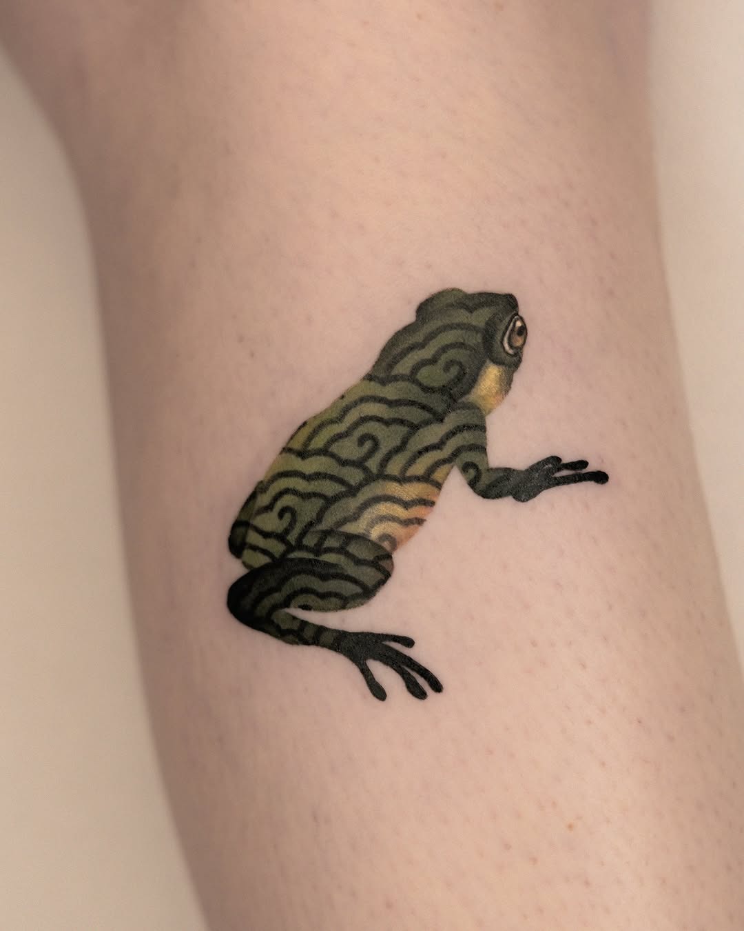 Artful frog tattoo with swirling patterns Tattoo Design