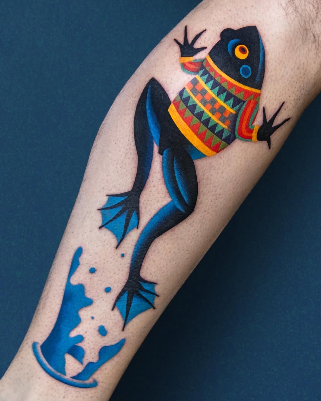 Vibrant frog tattoo with unique sweater design Tattoo Design