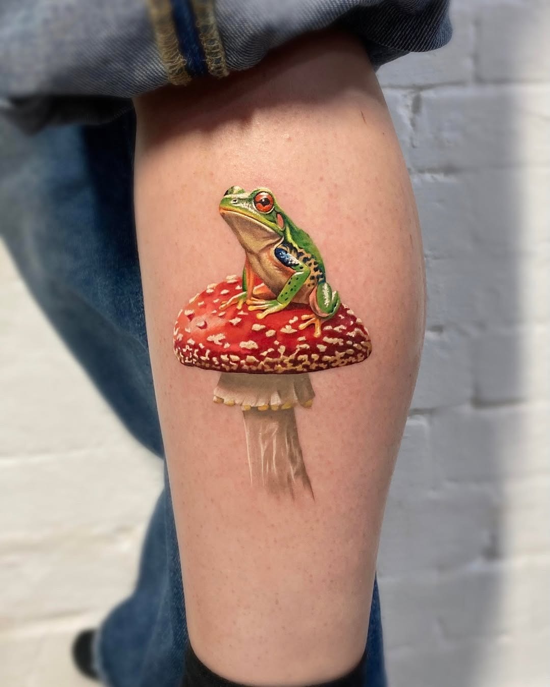 Whimsical frog tattoo sitting on a mushroom Tattoo Design