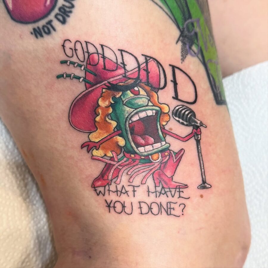 A comical monster tattoo with a microphone Tattoo Design