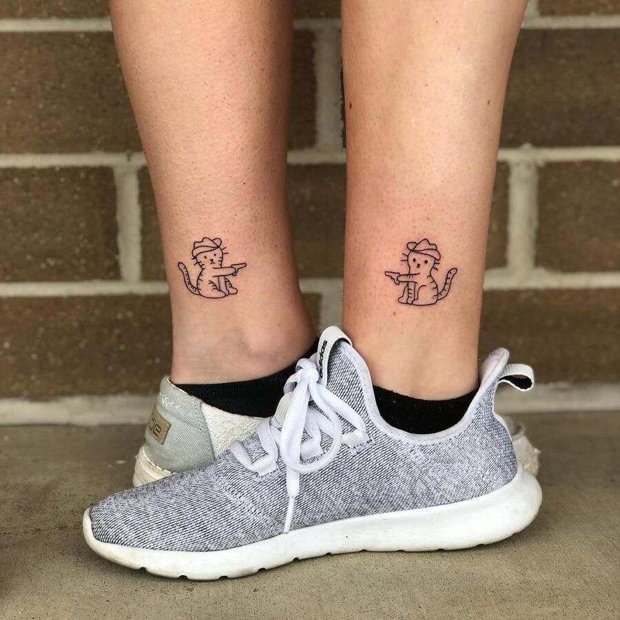 Whimsical cats causing playful mischief Tattoo Design