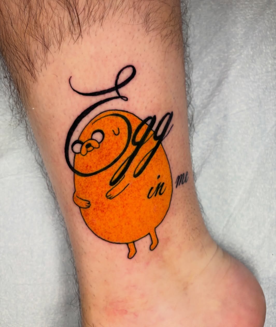 Whimsical tattoo featuring a cheerful egg character Tattoo Design