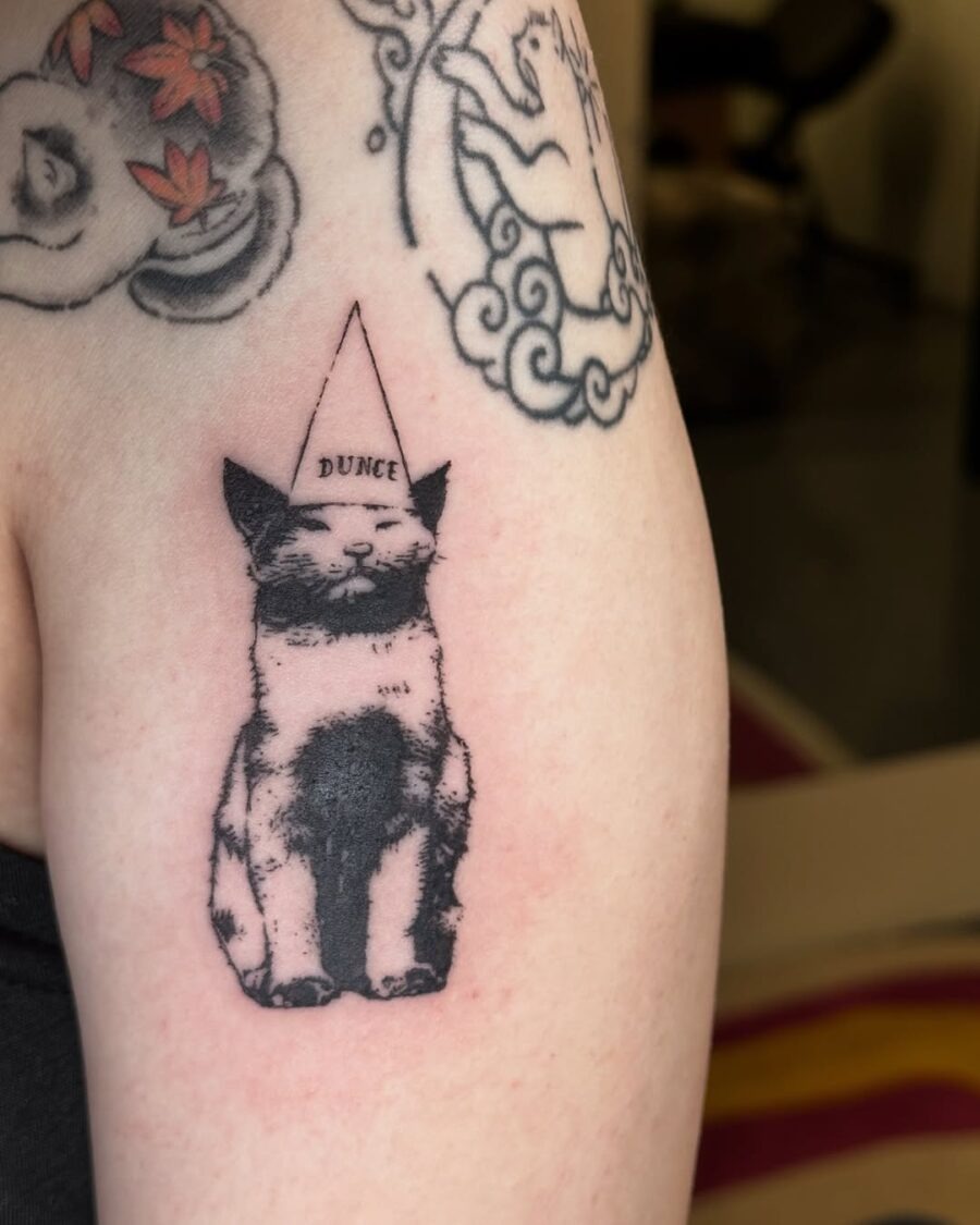 Witty Cat Tattoo with Dunce Cap Tattoo Design