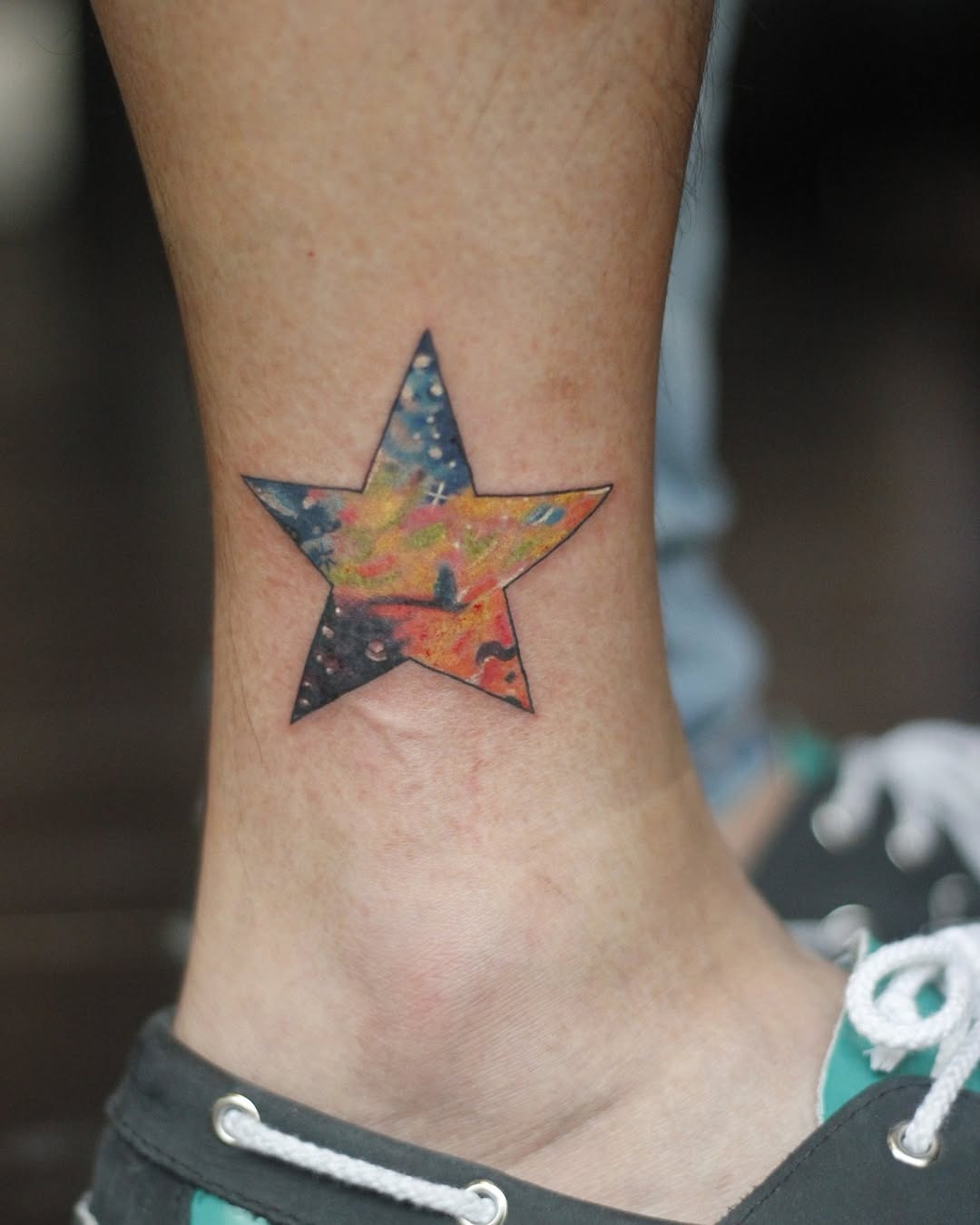 Colorful galaxy star tattoo on the ankle Tattoo Design