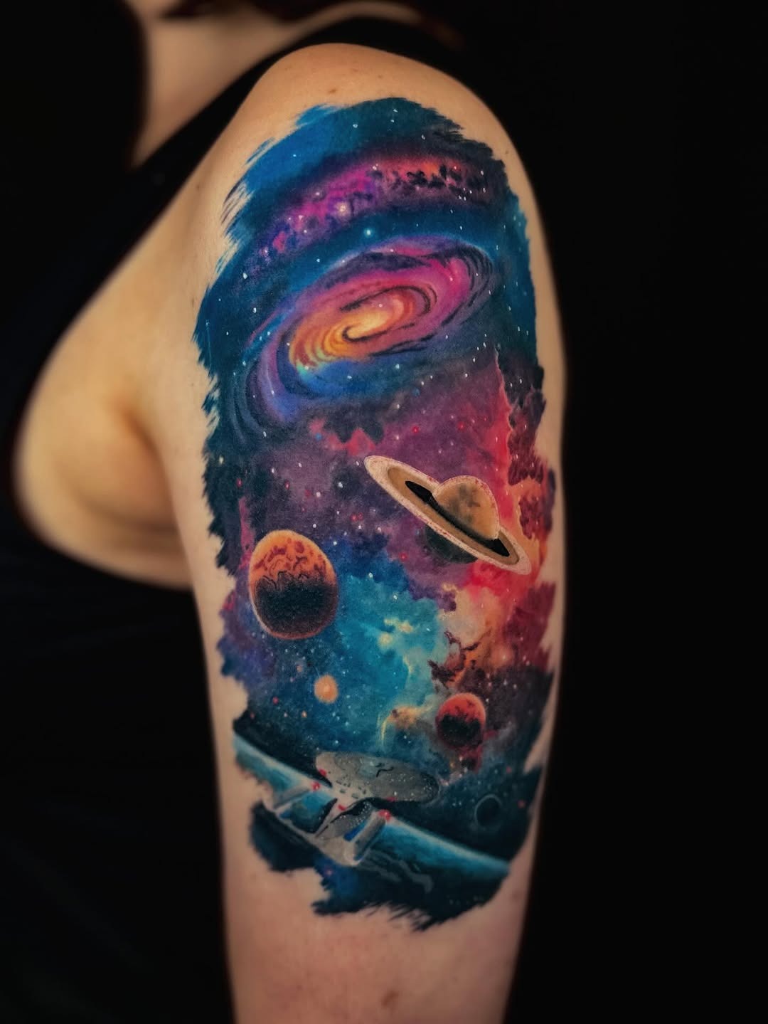 Colorful galaxy tattoo with planets and spaceship Tattoo Design