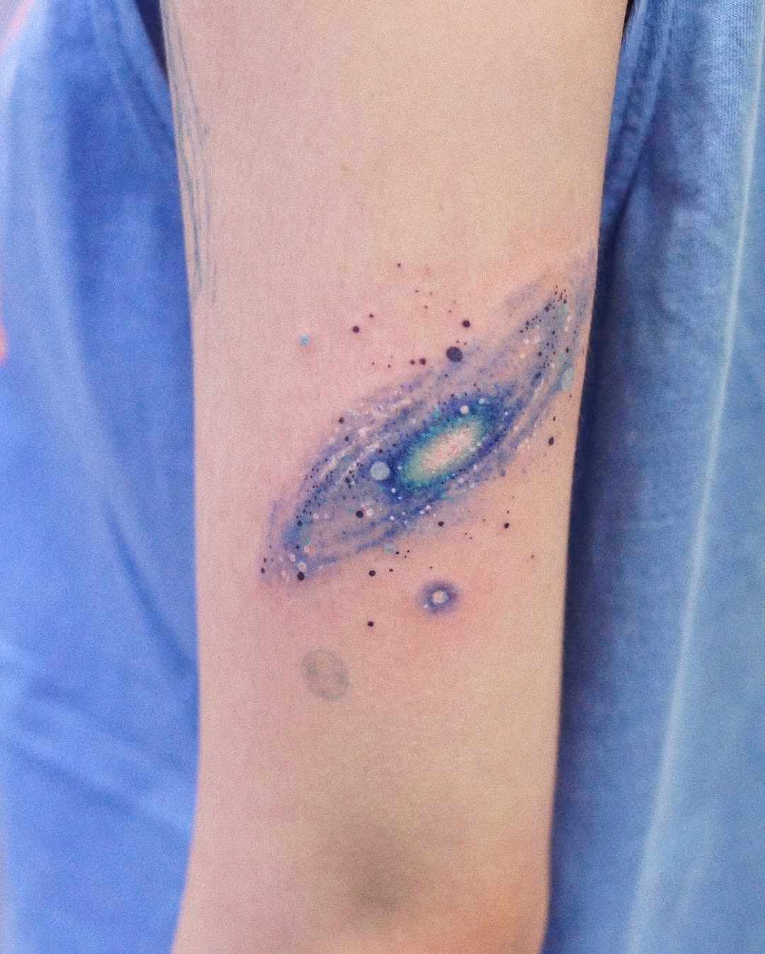 Cosmic beauty in vibrant galaxy tattoo Tattoo Design