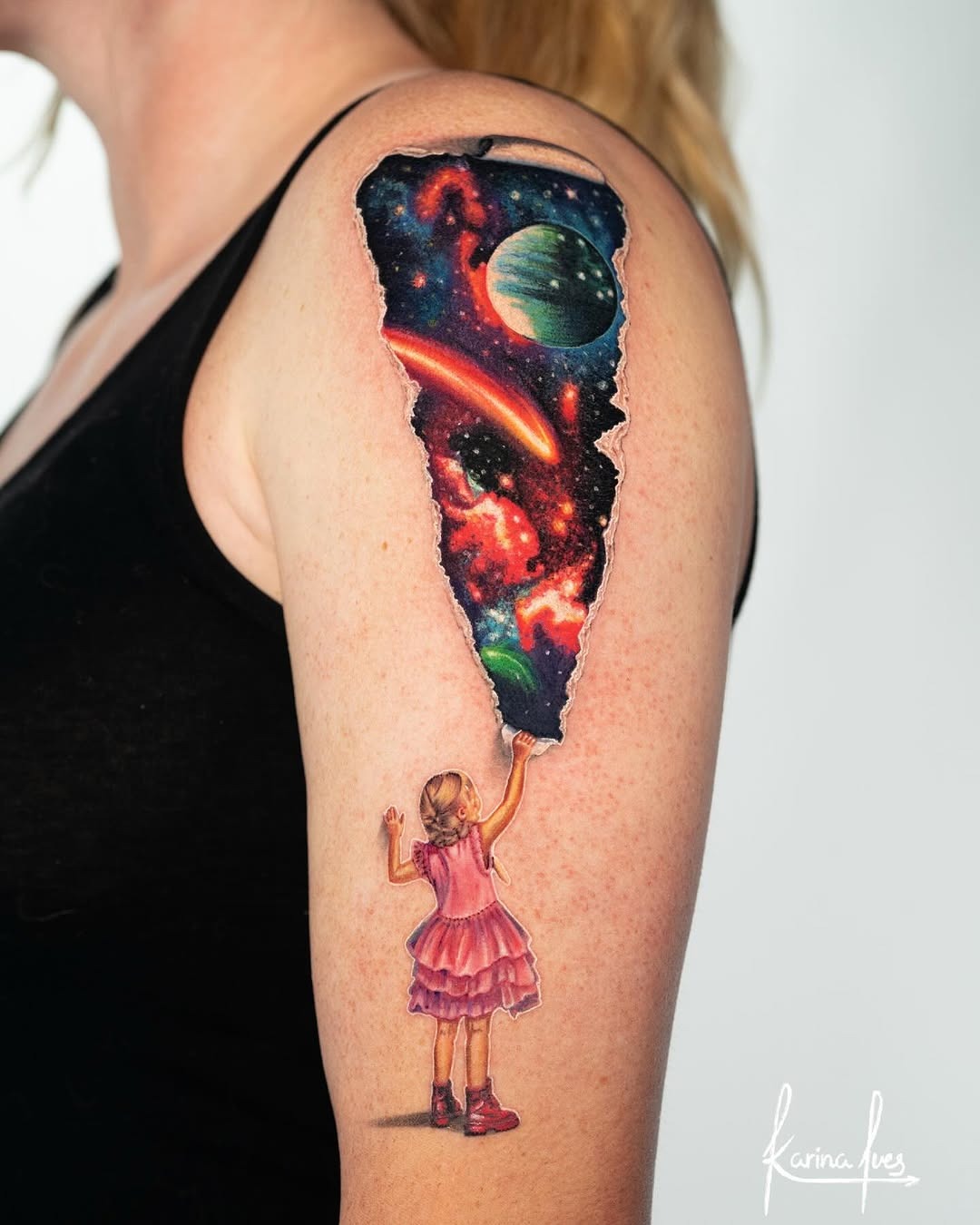 Girl with Bright Galaxy Tattoo on Arm Tattoo Design