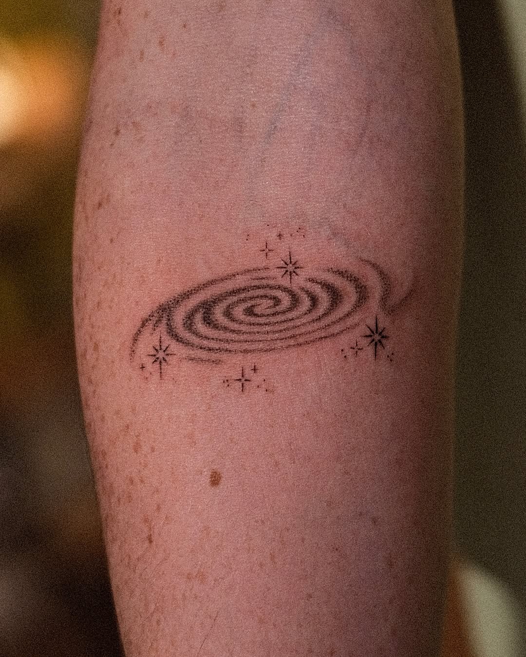Intricate galaxy swirl tattoo with star accents Tattoo Design
