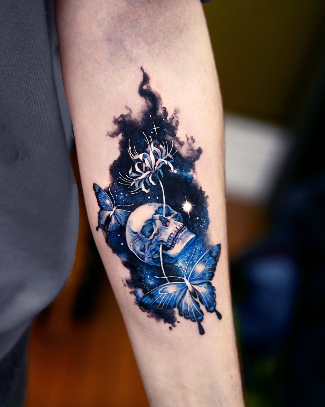 Stunning galaxy-inspired skull and butterfly tattoo. Tattoo Design