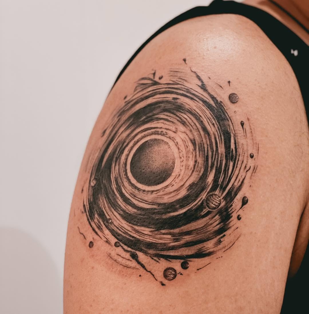 Unique galaxy swirl tattoo on shoulder Tattoo Design