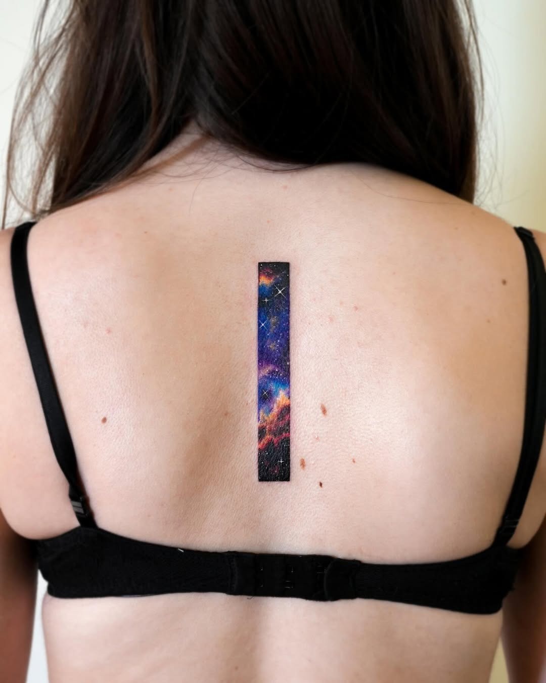 Unique Vertical Galaxy Tattoo Design on Back Tattoo Design