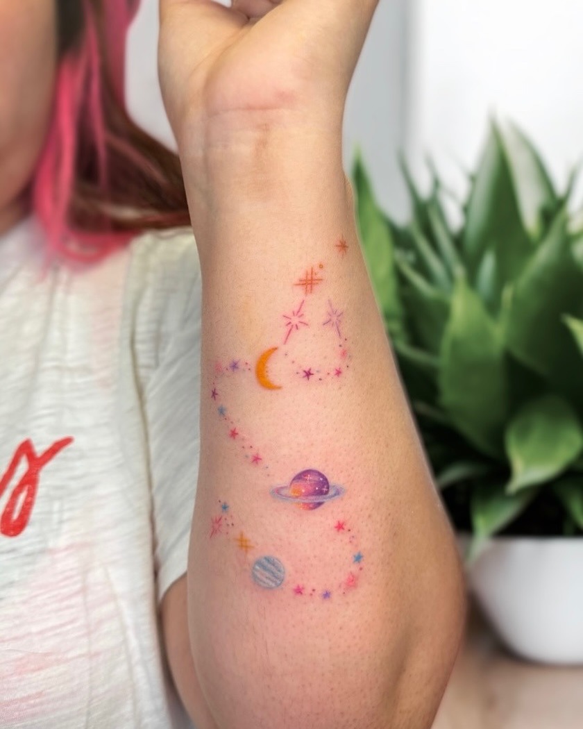 Vibrant Galaxy Tattoo Design on Arm Tattoo Design