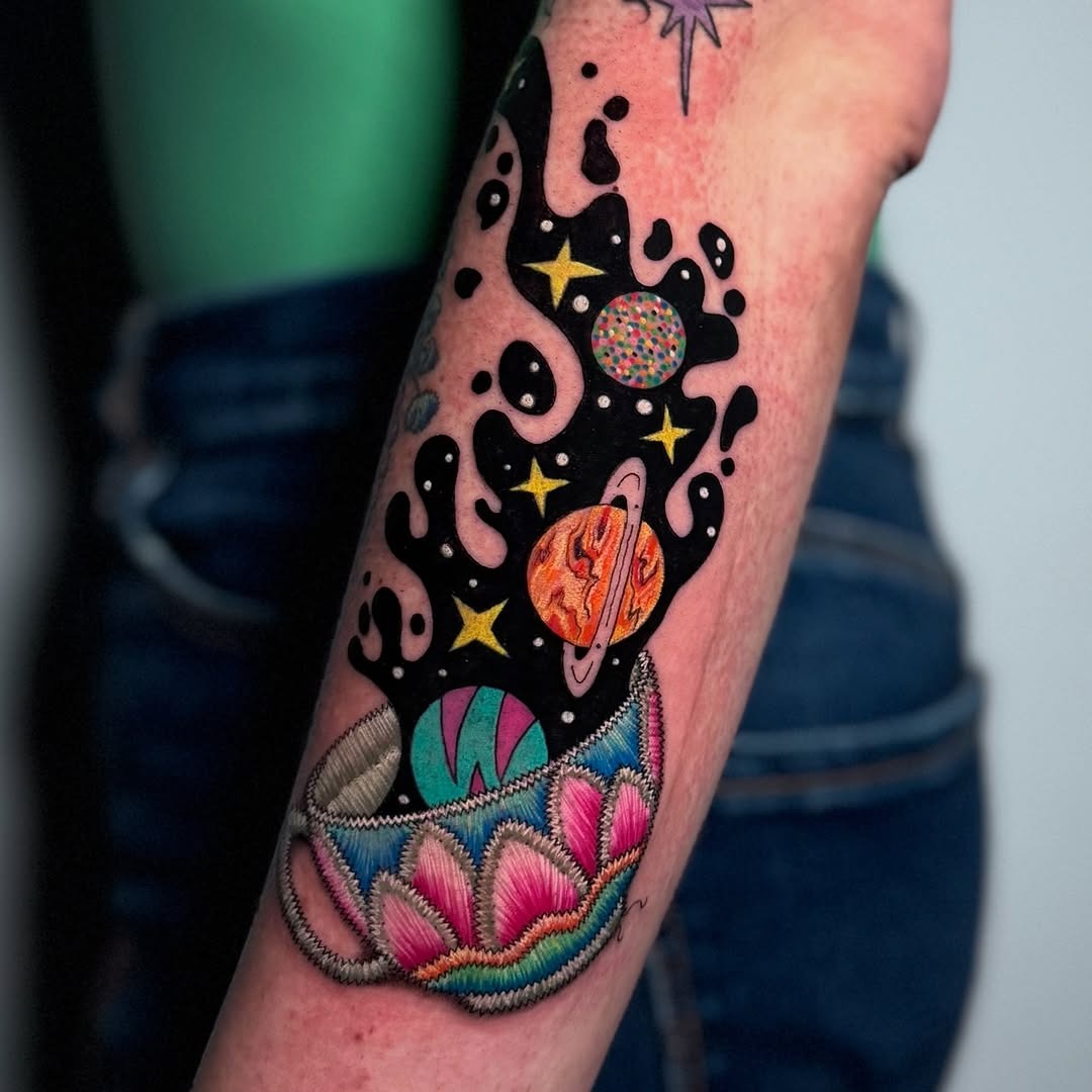 Vibrant galaxy tattoo with floral elements Tattoo Design