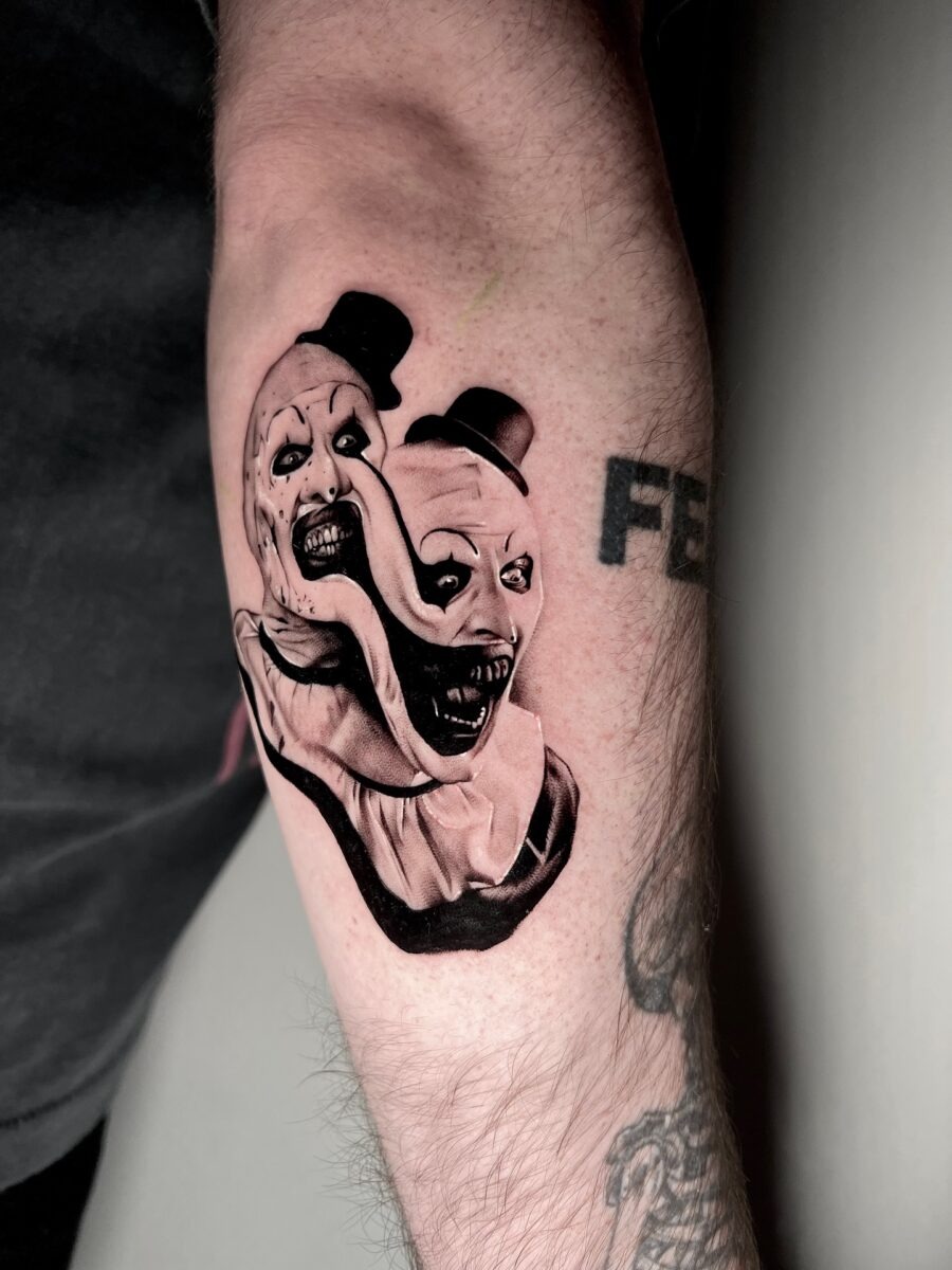 Dual-faced clown tattoo for eerie vibes Tattoo Design