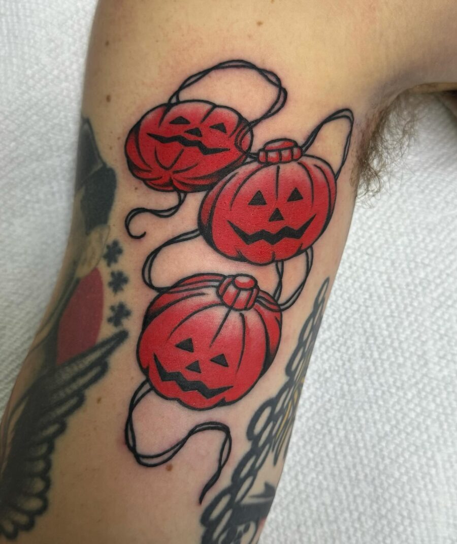 Vibrant Halloween Pumpkins with Playful Expressions Tattoo Design