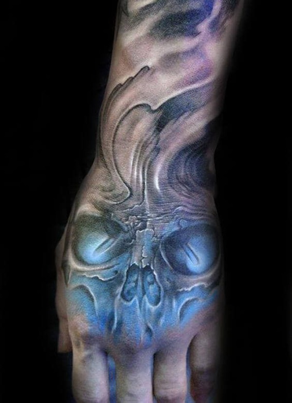 Haunting Blue Skull Hand Tattoo Ideas Tattoo Design