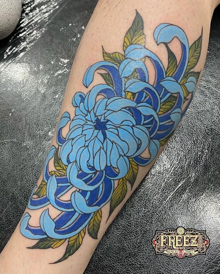 Blue Chrysanthemum with Graphic Movement Tattoo Design