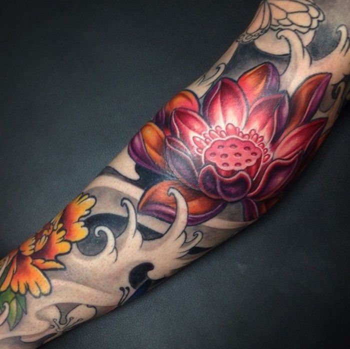 Lotus Bloom with Flowing Waves Tattoo Design